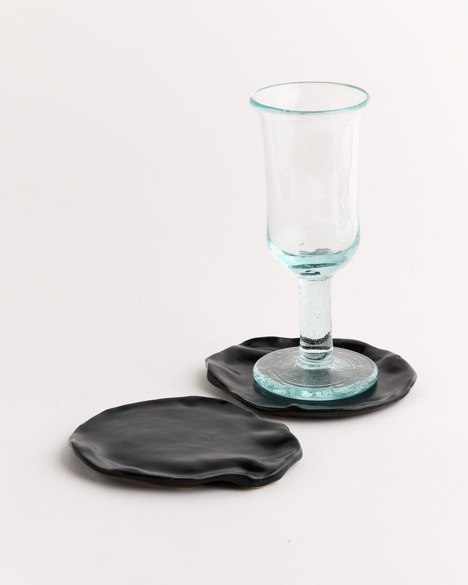 The Mostly Flat Set of 2 Coasters in Matte Black